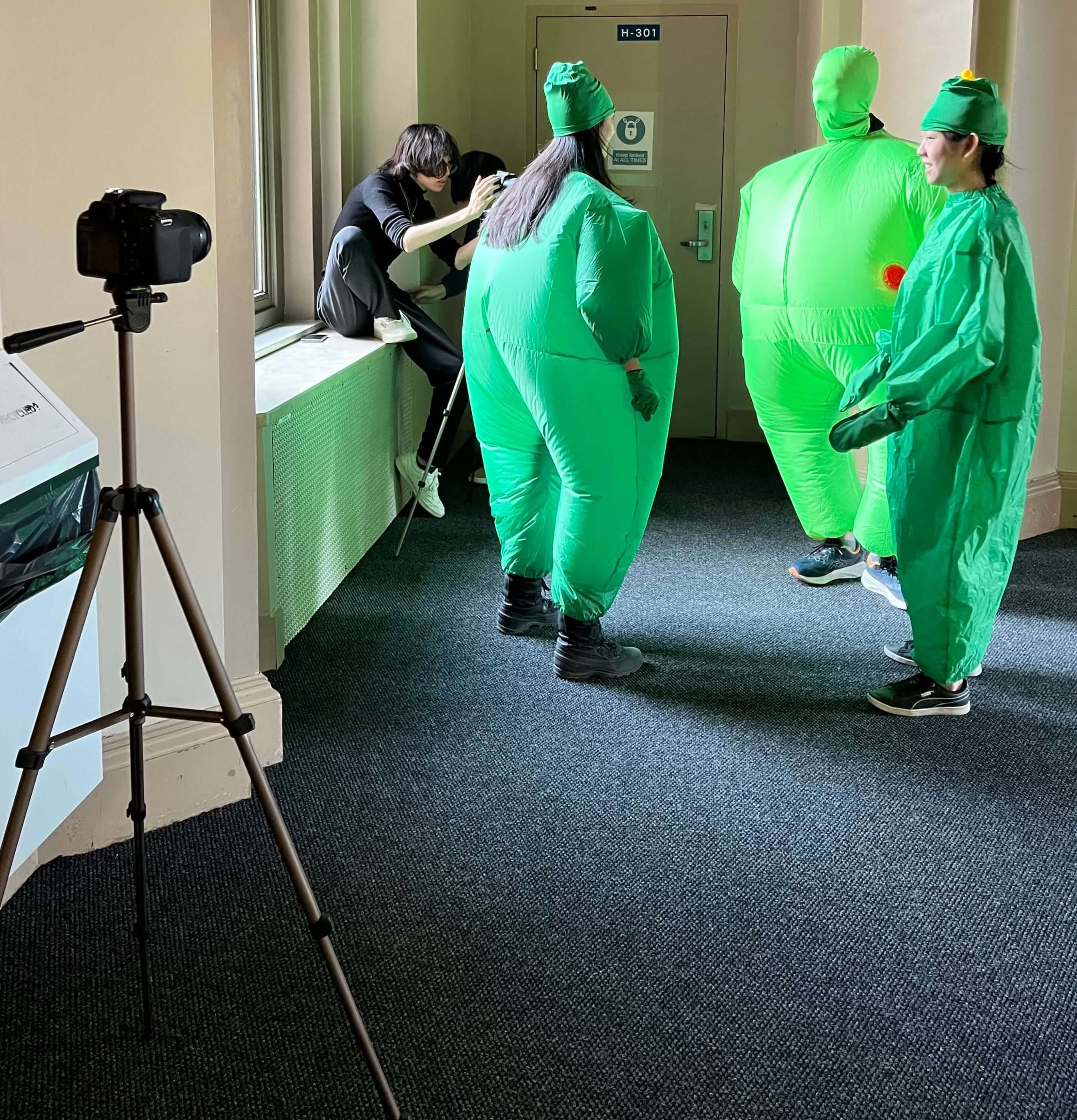 Filming the scene with three pigs discussing.